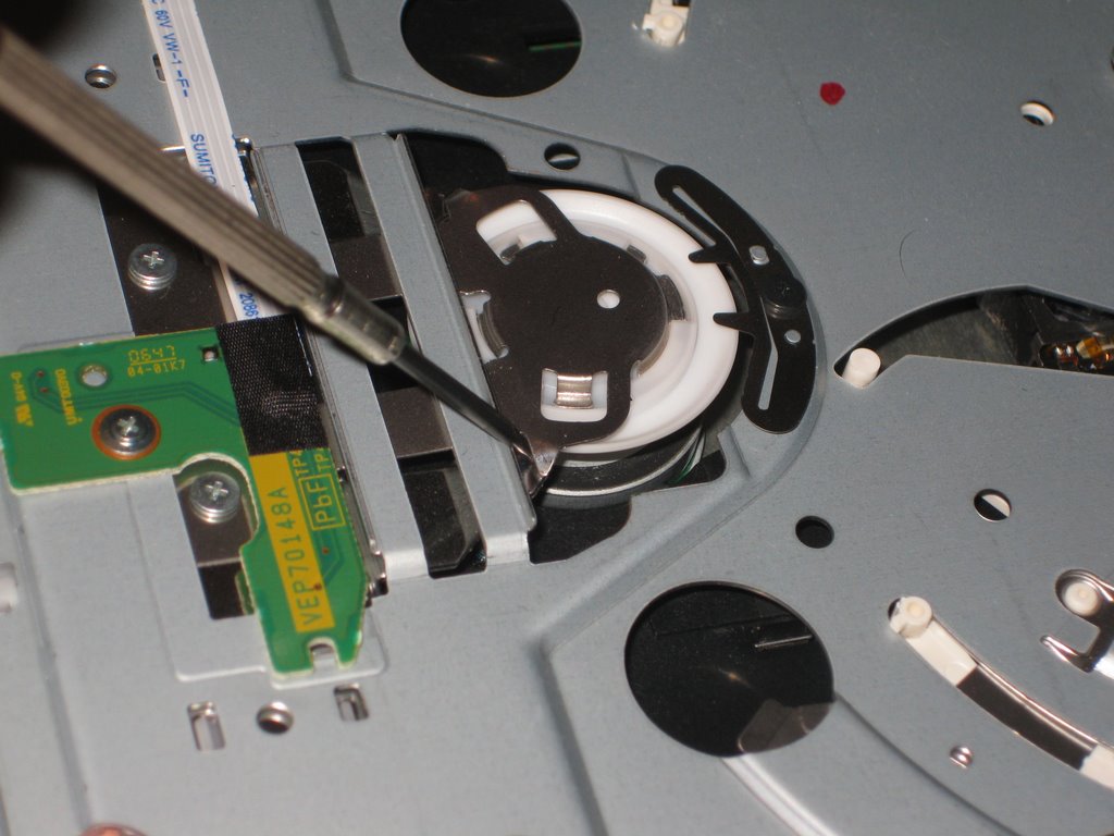 Bend these small pieces down to stop the Wii disc drive's loud noise.